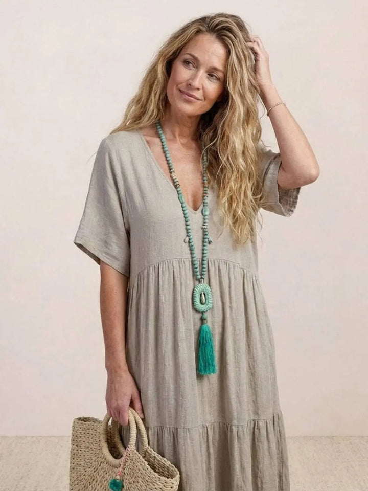 Loose fit short sleeve tiered maxi dress, women's boho V-neck for summer fun.