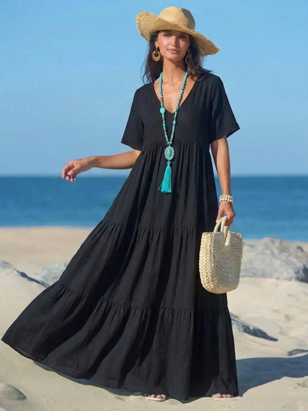 Women's flowy boho V-neck tiered maxi dress, casual elegance for summer.