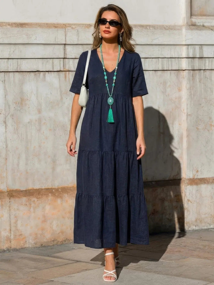 Women's boho swing dress, tiered design, V-neck, loose fit for summer ease.
