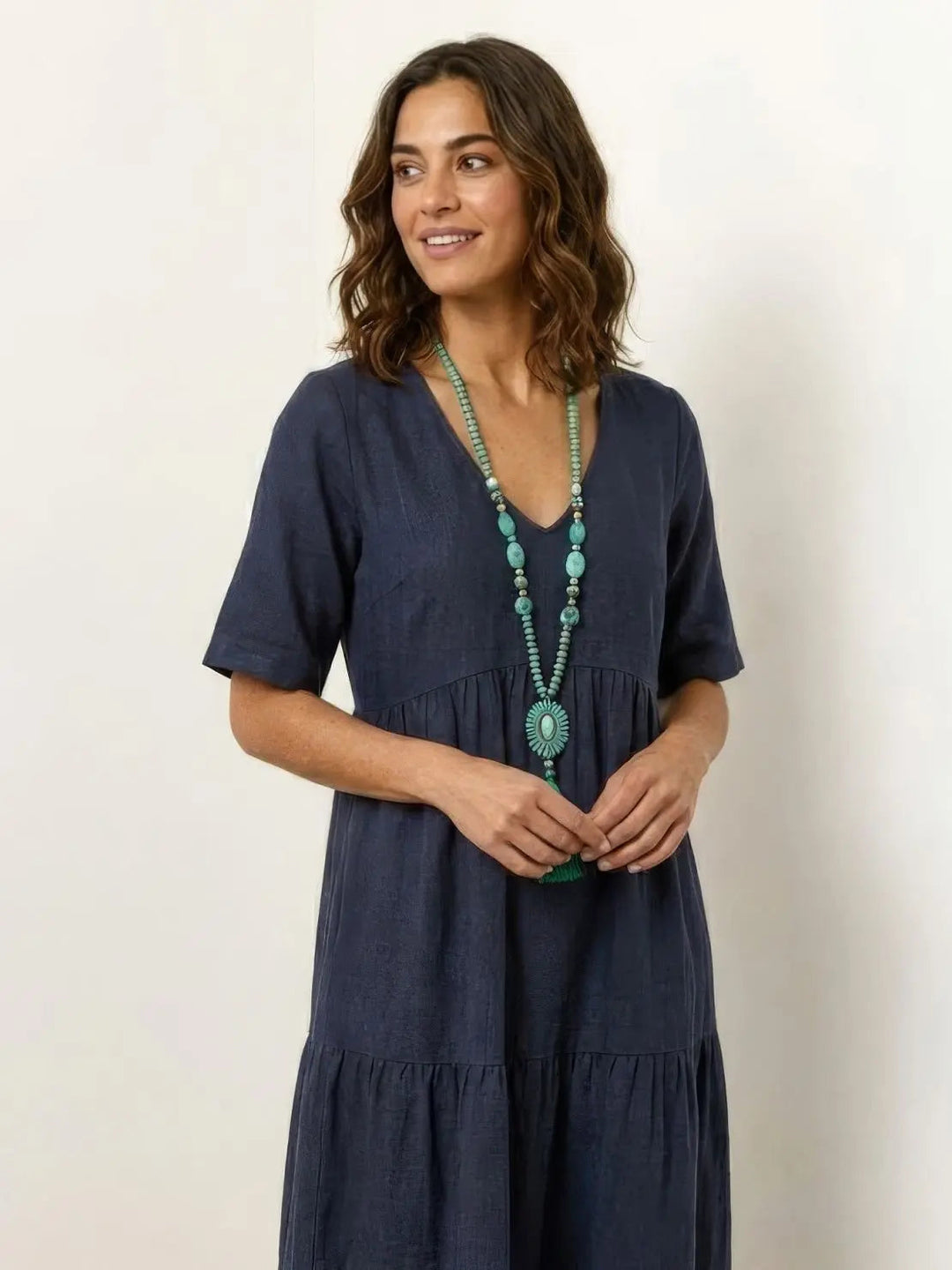 Chic women's V-neck tiered maxi dress, bohemian swing style, summer fashion.