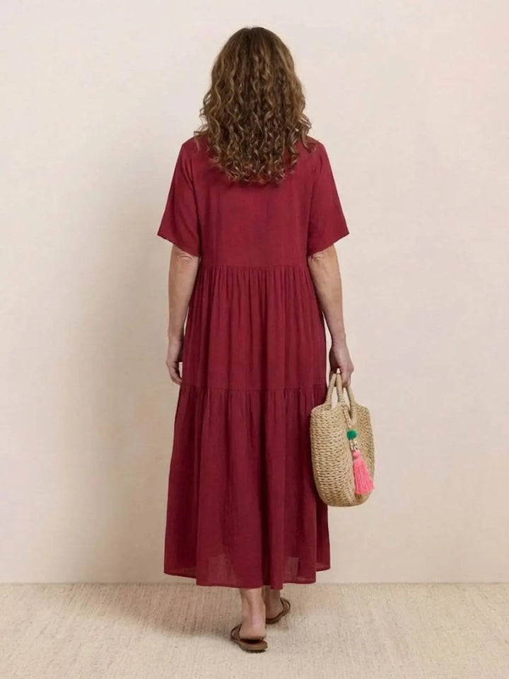 Bohemian women's summer dress, V-neck tiered maxi, perfect for beach comfort.