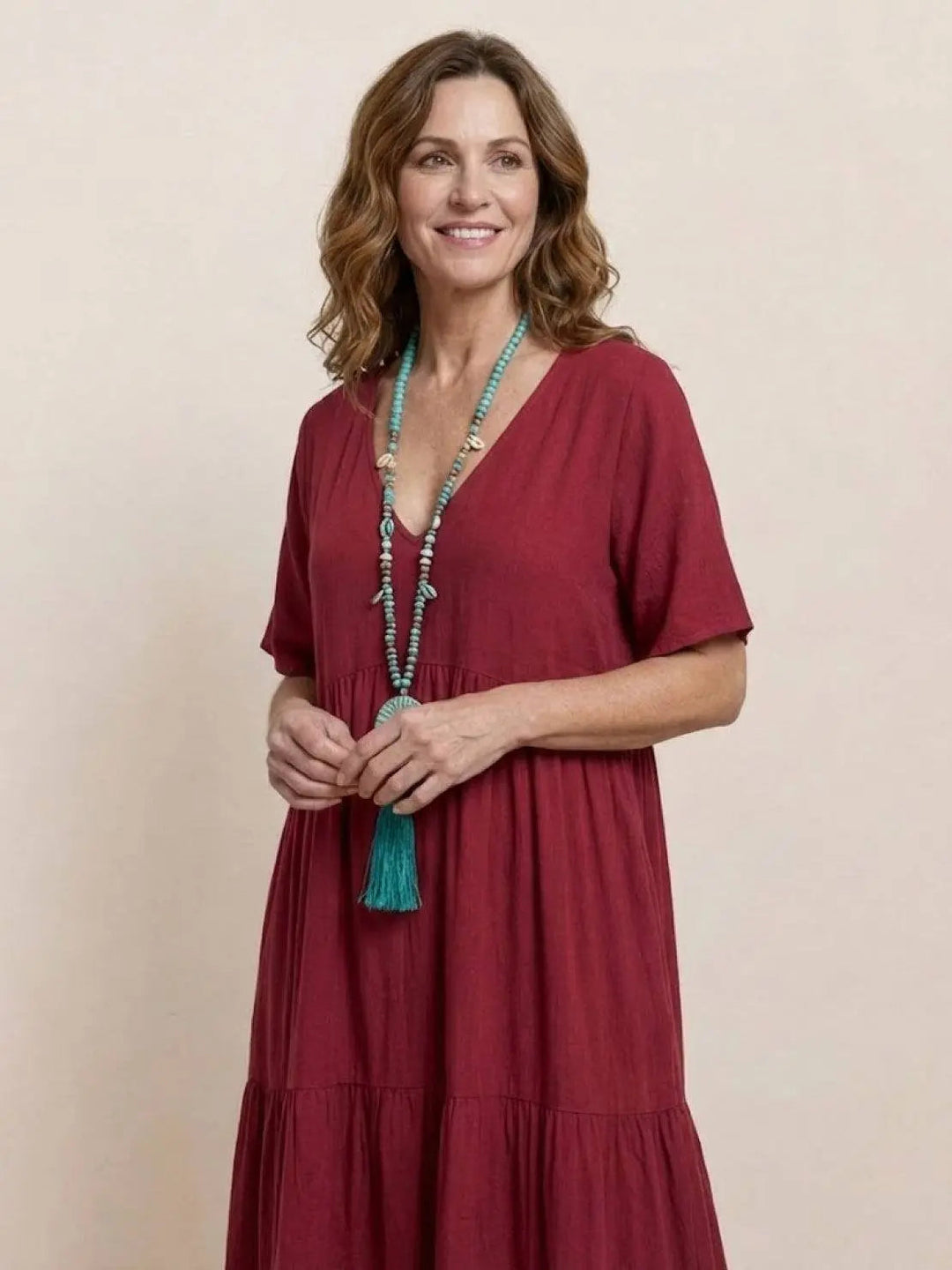 Elegant women's tiered maxi dress, boho V-neck, short sleeve, resort wear.
