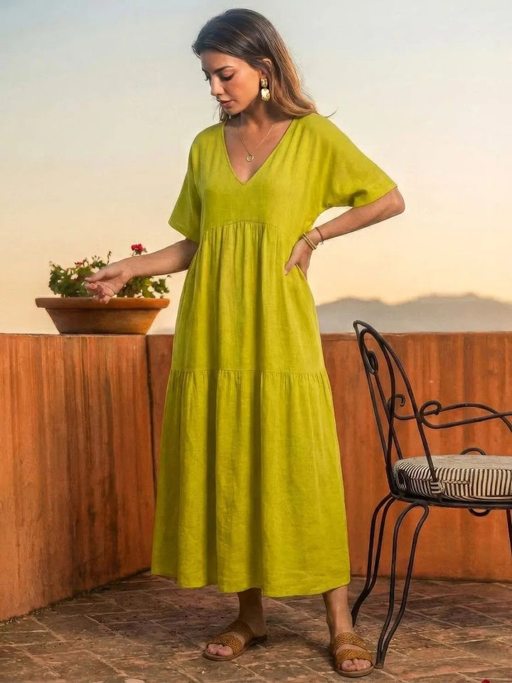 Chic women's V-neck tiered maxi dress, bohemian swing style, summer casual.