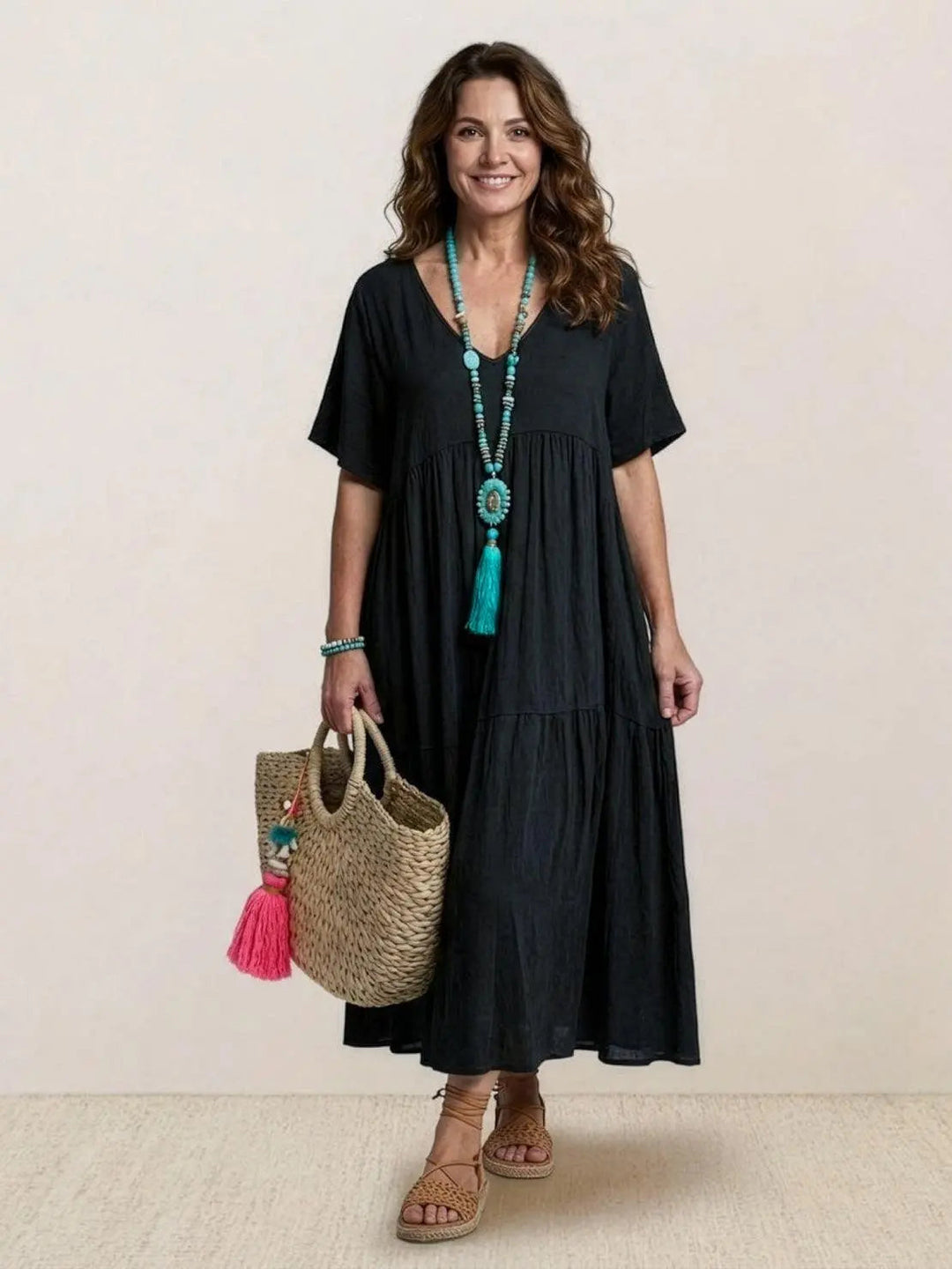 Bohemian short sleeve maxi dress with tiered design for summer beach wear.