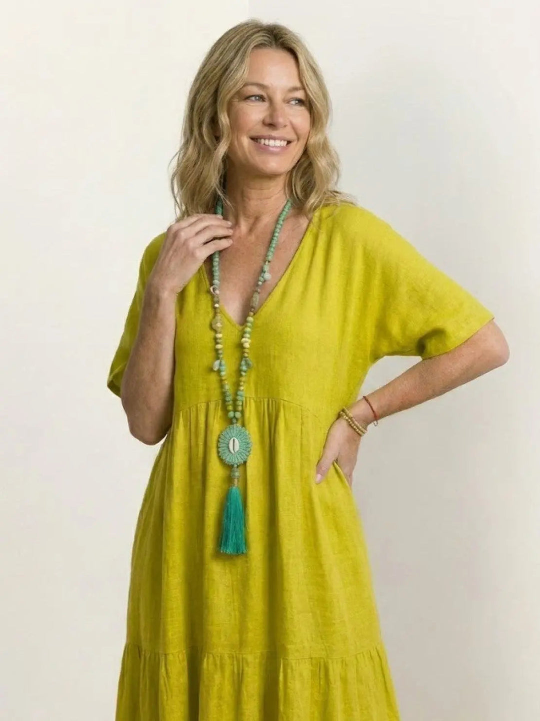 Bohemian women's summer dress, V-neck tiered maxi, perfect for beach trips.