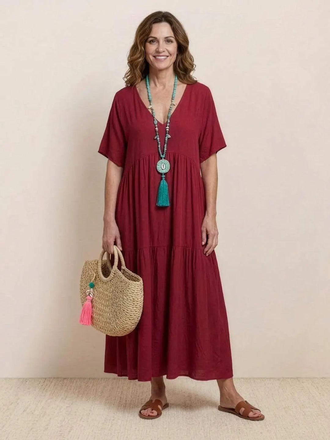 Stylish women's summer swing dress, V-neck & tiered details, flowy elegance.