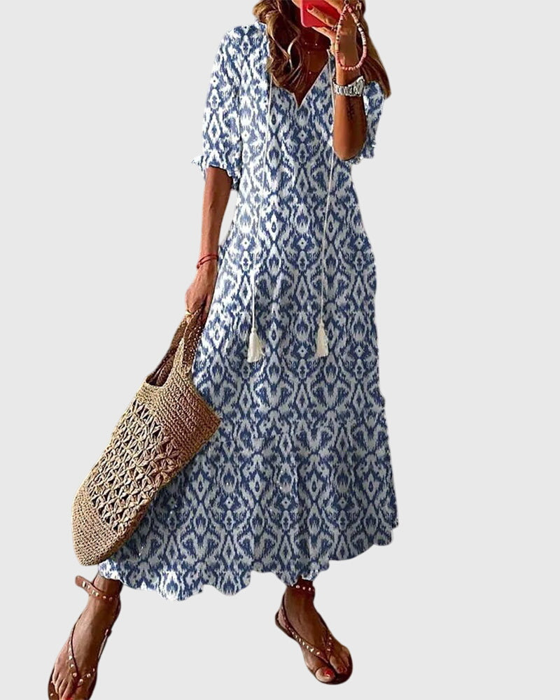 Women's boho vintage summer maxi dress, flowy and chic for beach or casual wear.
