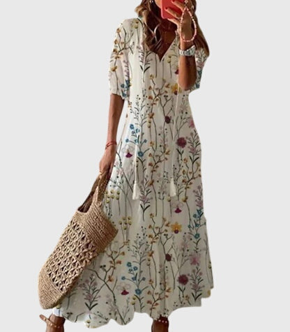 Women's flowy summer maxi dress, boho vintage design, ideal for beachwear or vacation elegance.