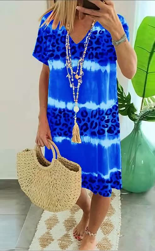 Women's bold print v-neck shift dress with short sleeves, perfect for relaxed summer style & comfort.