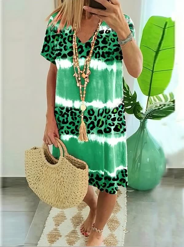 Vibrant, colorful bold print v-neck shift dress for women, ideal as a casual and comfortable summer outfit.