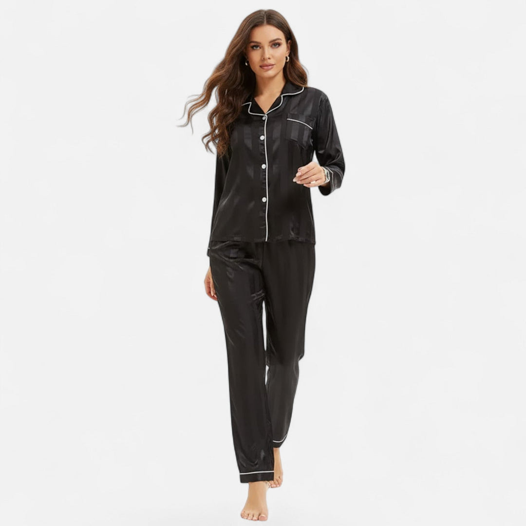 Stylish women's long sleeve lounge set with bold stripes. Relaxed fit for elegant comfort.