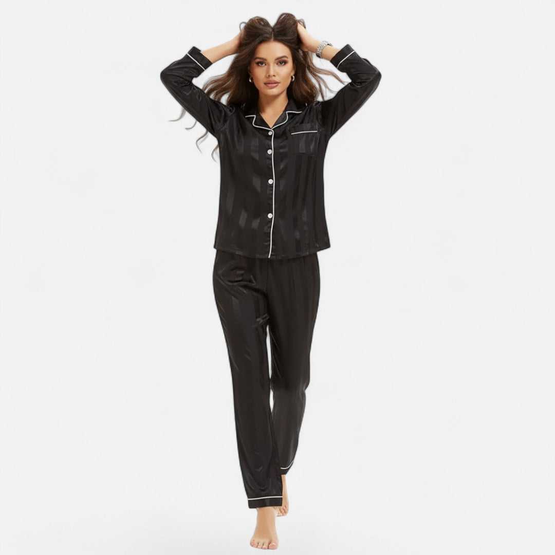 Elegant women's two-piece lounge set. Bold stripe long sleeve top & pants for relaxed at-home wear.