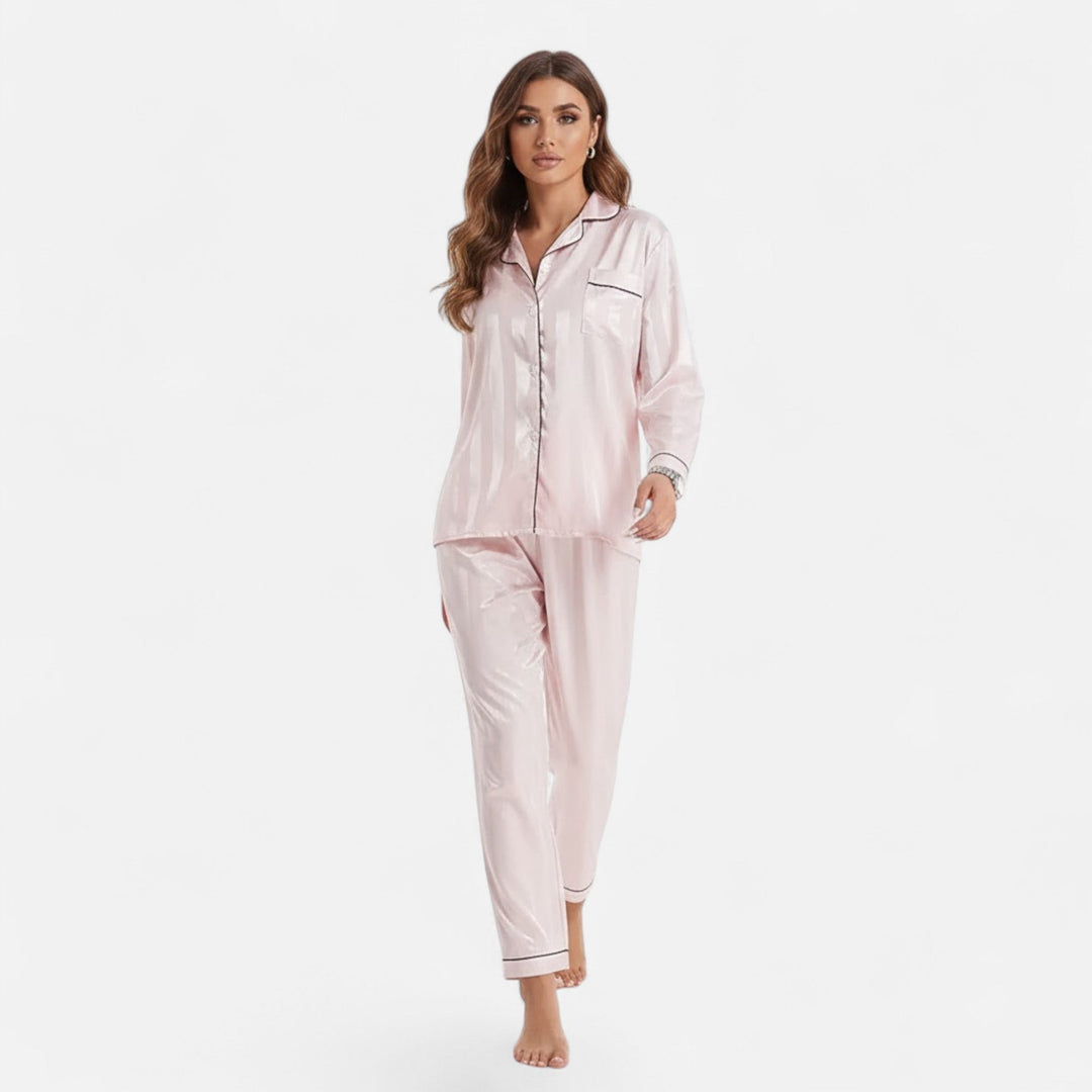 Women's long sleeve two-piece set featuring bold stripes. Elegant, relaxed fit loungewear.