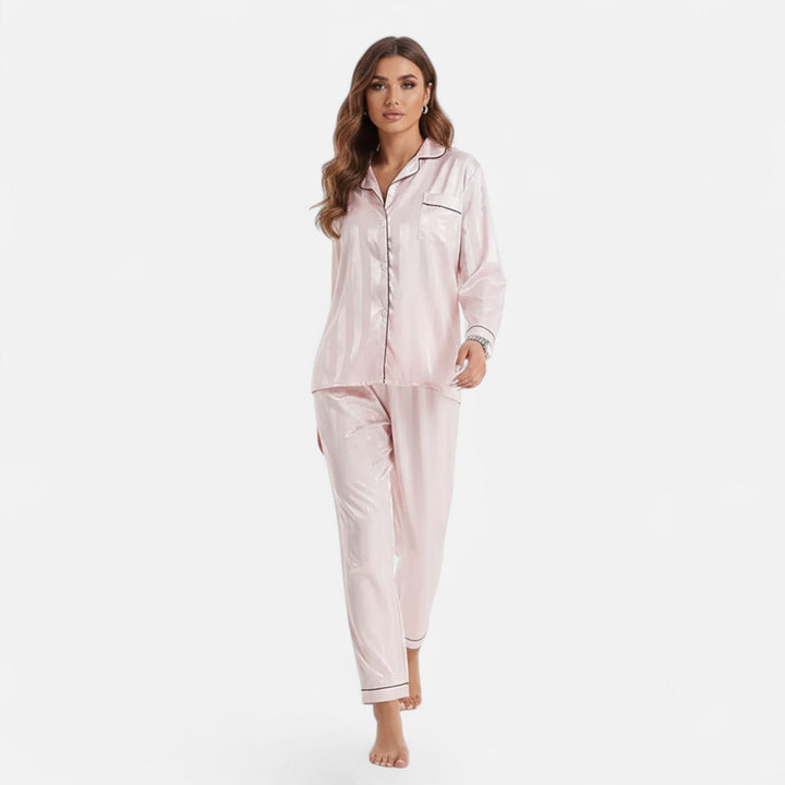 Women's long sleeve two-piece set featuring bold stripes. Elegant, relaxed fit loungewear.