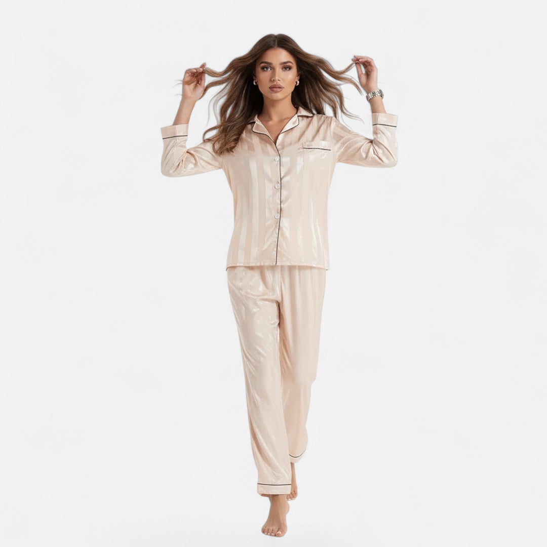 Relaxed fit women's bold stripe lounge set. Long sleeve two-piece for elegant, comfortable loungewear.