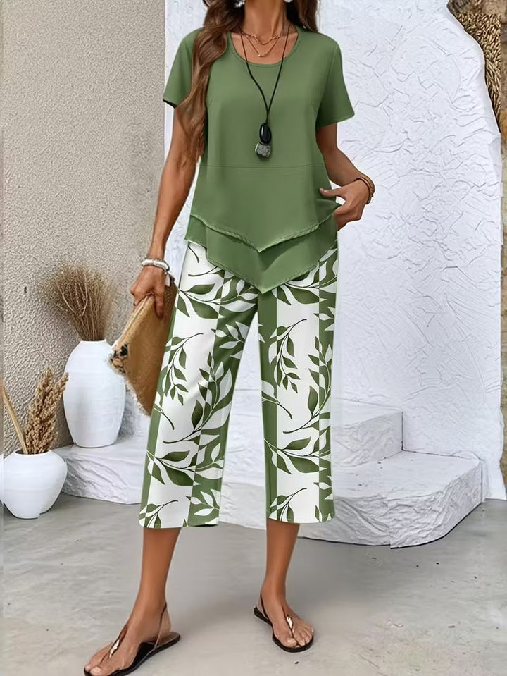 Women's botanical print two-piece set. Vibrant summer fashion matching outfit with relaxed fit.