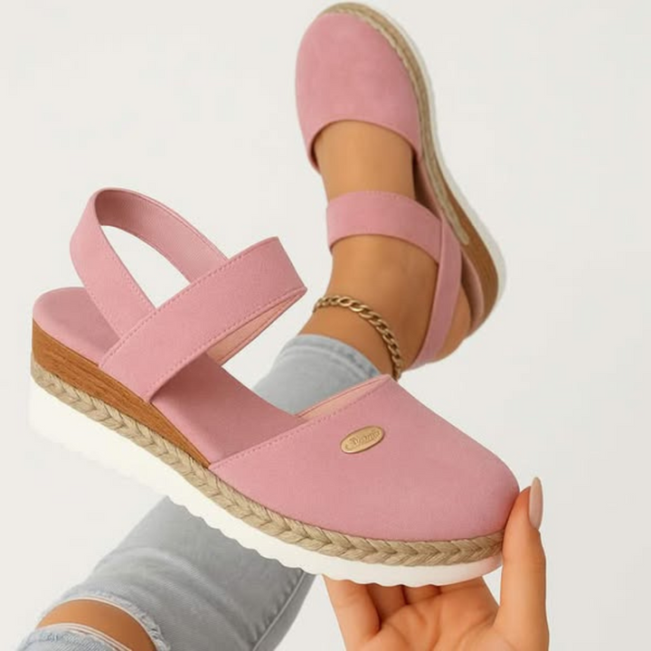 Chic women's braided closed toe sandals with elevated sole, ideal for comfortable summer fashion.