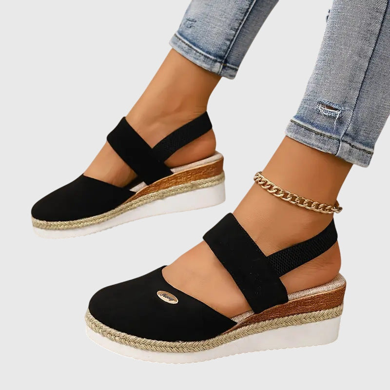 Stylish women's braided closed toe sandals, featuring an elevated sole for modern everyday fashion.