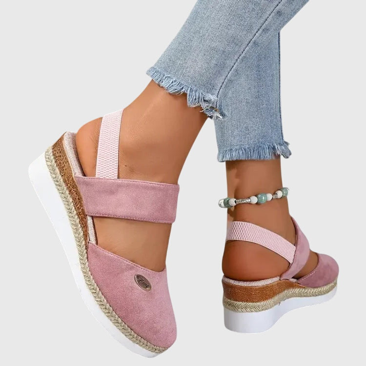 Fashionable women's braided elevated sandals, closed toe and strapped for a chic summer everyday look.