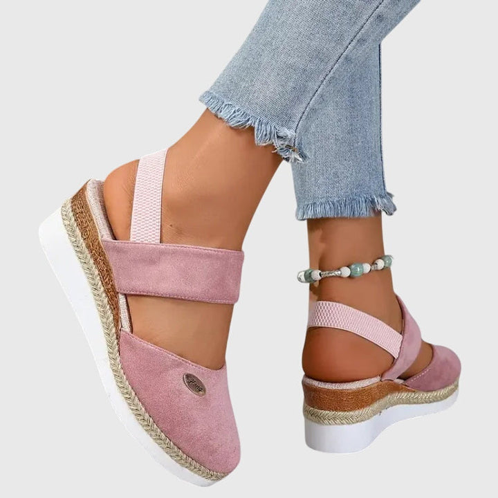 Fashionable women's braided elevated sandals, closed toe and strapped for a chic summer everyday look.