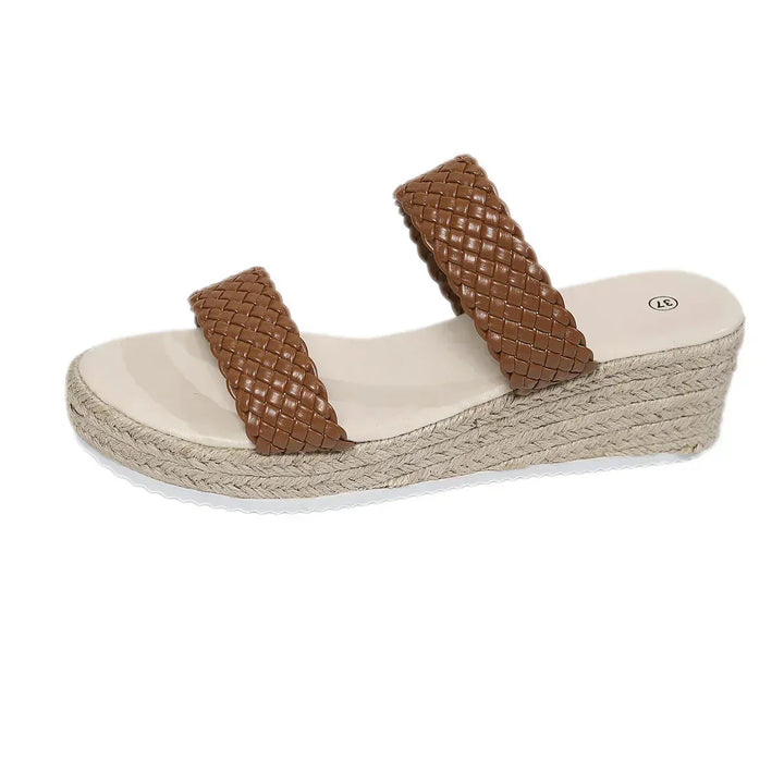 Comfortable women's slip-on wedge sandals featuring stylish braided straps & cushioned espadrille sole.