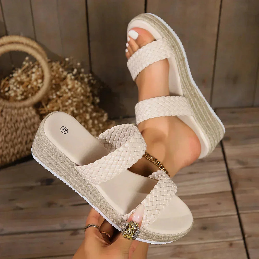 Easy slip-on women's braided wedge sandals. Enjoy cushioned comfort and stylish espadrille design for summer.