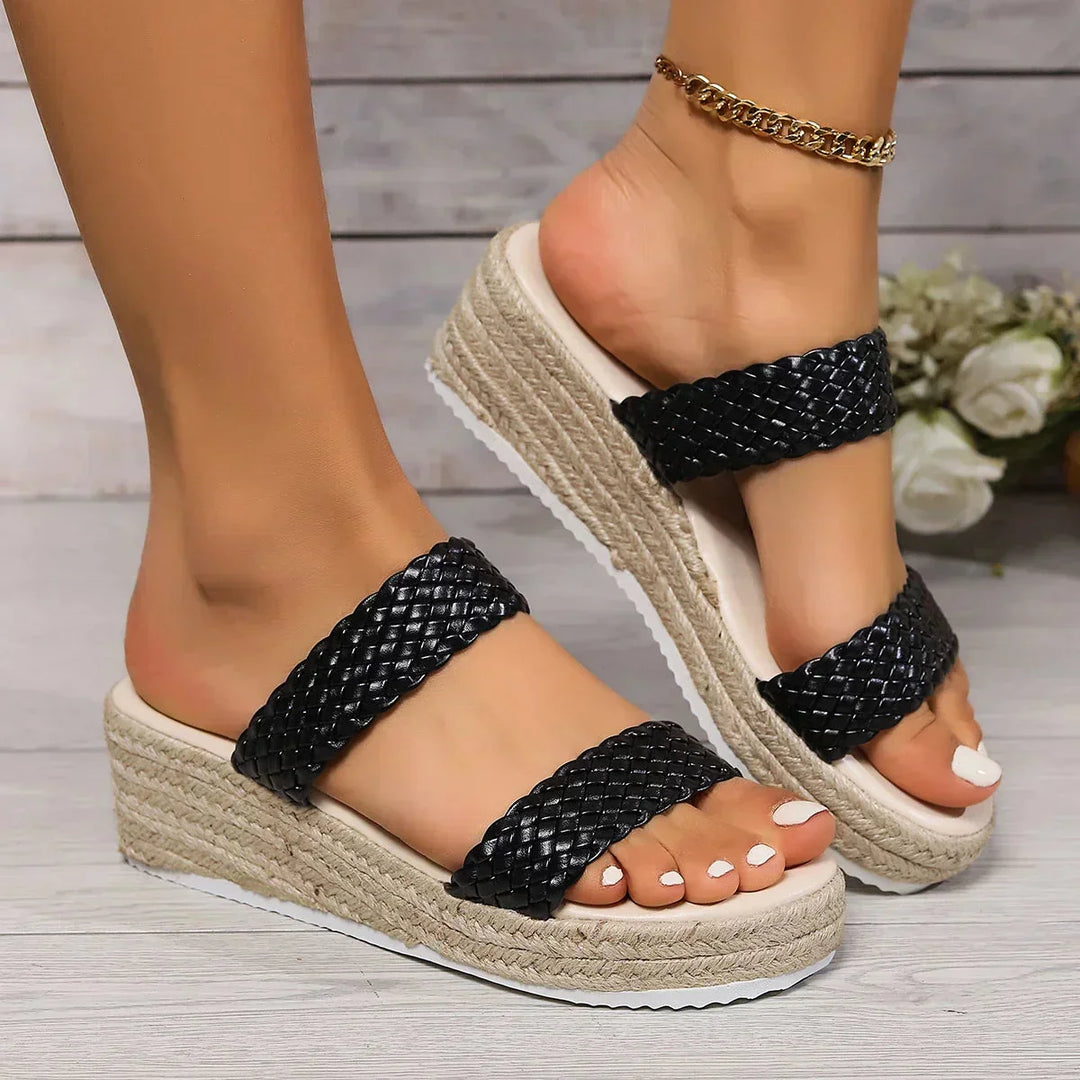 Braided strap women's wedge sandals with cushioned footbed. Chic slip-on espadrilles for comfortable summer days.
