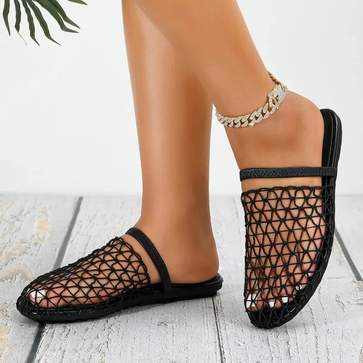 Closed-toe flat sandals for women, breathable woven design with a secure slingback strap.