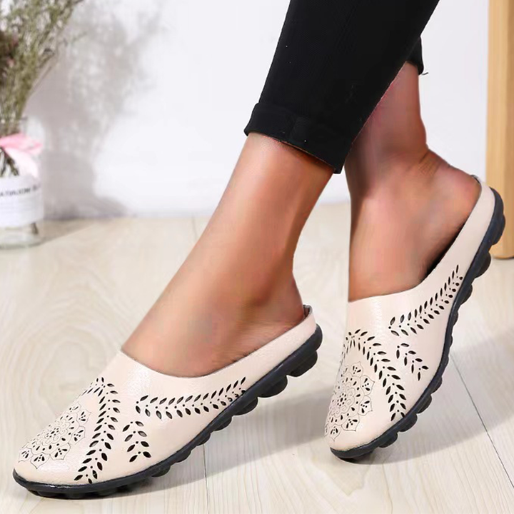 Lightweight women's slippers for ultimate comfort. Breathable design with soft cushioning for cozy indoor & outdoor wear.