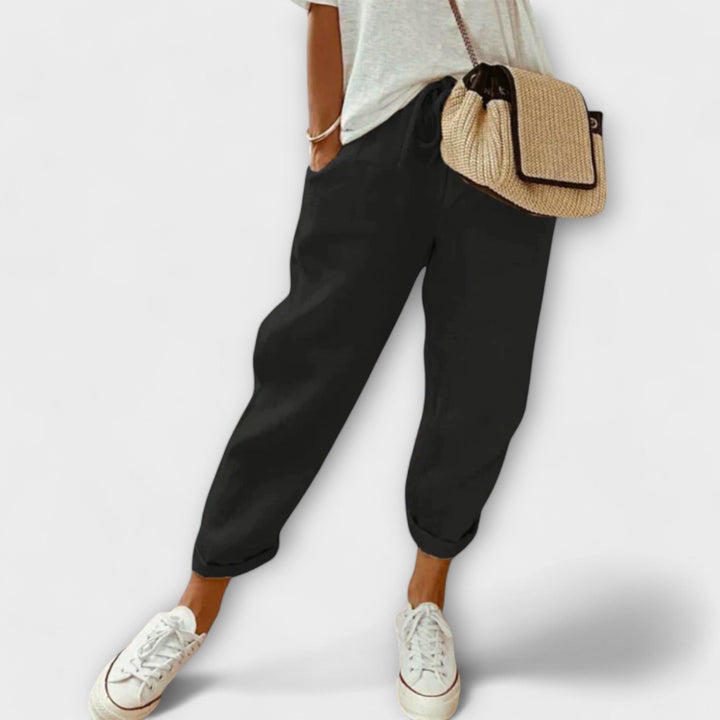 Comfortable women's relaxed-fit linen trousers, ideal for everyday wear & travel.
