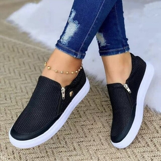 Women's breathable platform slip-on sneakers with convenient side zip, perfect for casual wear.