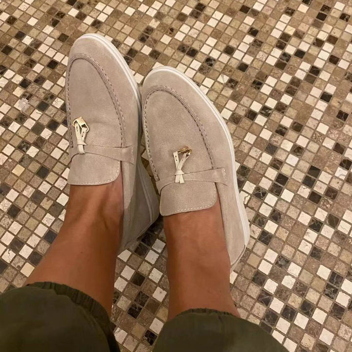 Rear view of women's comfortable pointed toe loafers. Breathable slip-on flats designed for all-day wear and style.