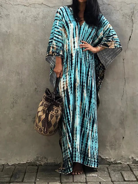 Effortless women's caftan dress, a flowing maxi for comfortable summer & resort wear.