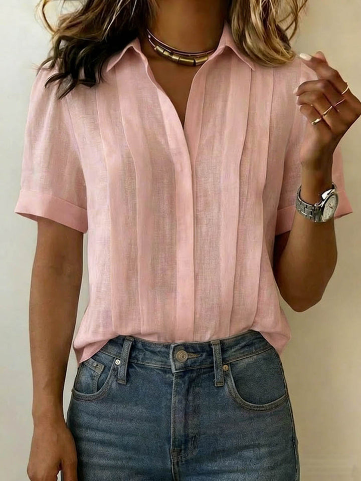 Elegant women's short-sleeve blouse in a breezy style, ideal for versatile everyday spring and summer wear.