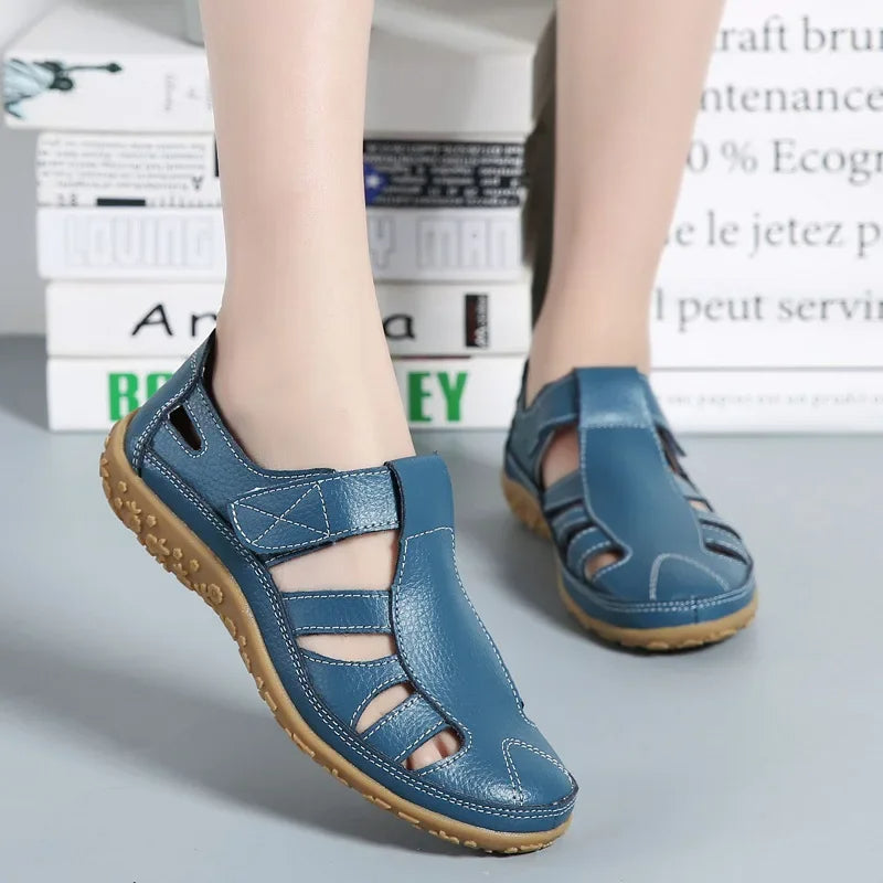 Close-up of adjustable velcro strap on women's comfort leather sandals.