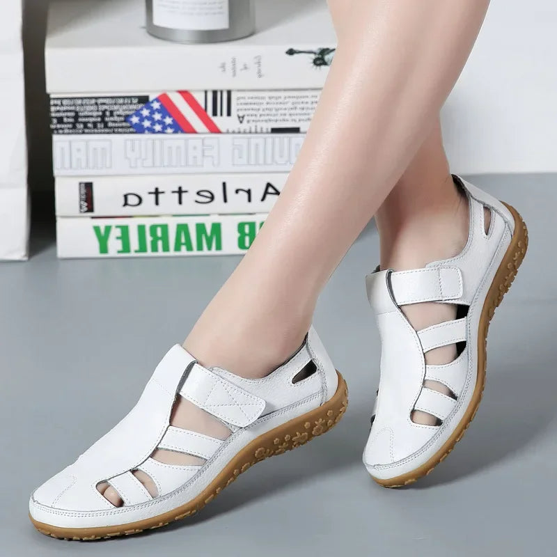 Orthopedic-inspired comfort sole women's leather walking sandals.