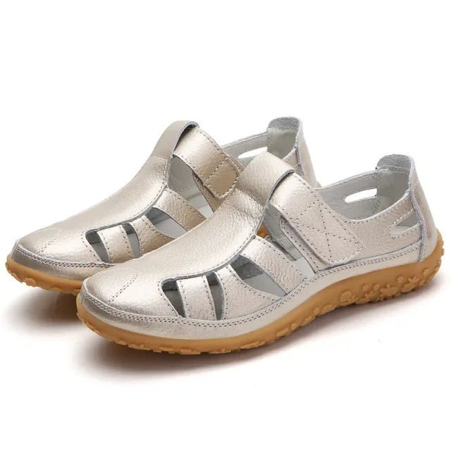 Women's wide-fit leather sandals featuring easy velcro adjustment.