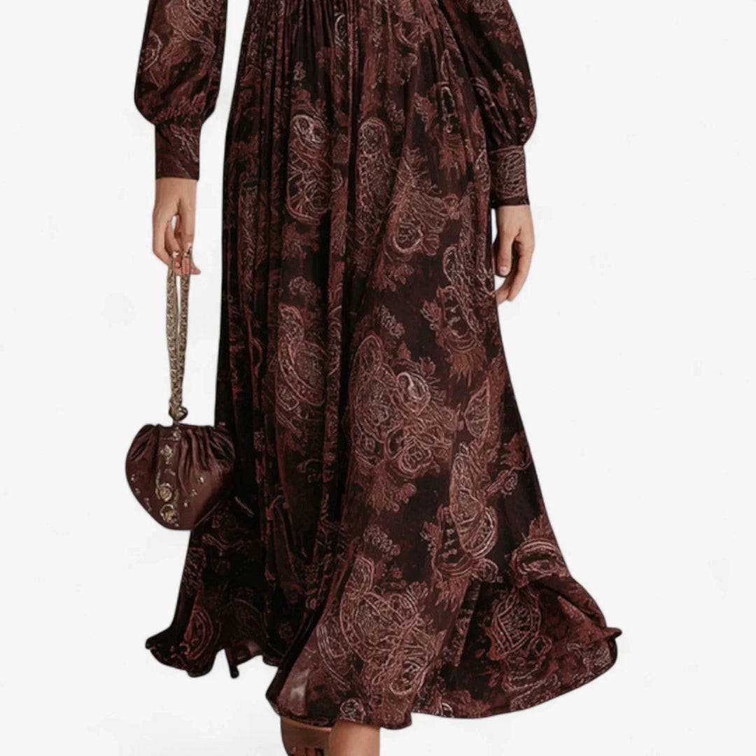 Brown women's maxi dress in paisley print, with a sophisticated collared v-neck and dramatic long balloon sleeves.