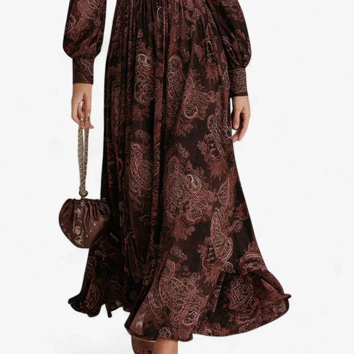 Brown women's maxi dress in paisley print, with a sophisticated collared v-neck and dramatic long balloon sleeves.