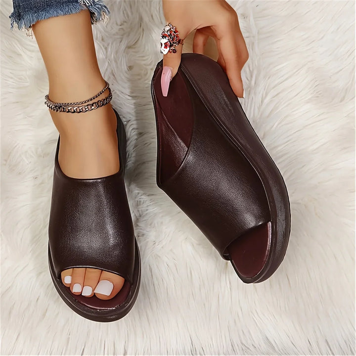Elegant brown wedge sandals, women's slip-on style, ideal for summer fashion and casual outdoor activities.