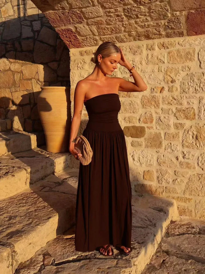 Stylish women's strapless brown pleated maxi summer dress, suitable for parties & formal occasions.