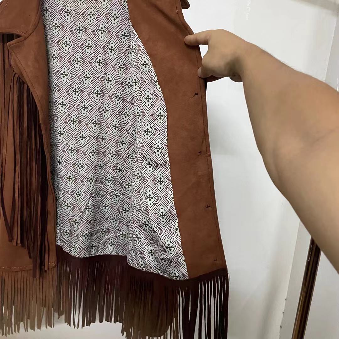 Model posing in a women's stylish fringe suede jacket, highlighting its comfortable silhouette