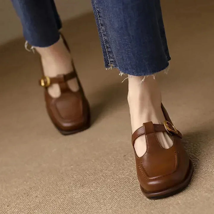 Side profile of comfortable women's brown T-Strap Mary Jane block heel shoes, classic workwear style.