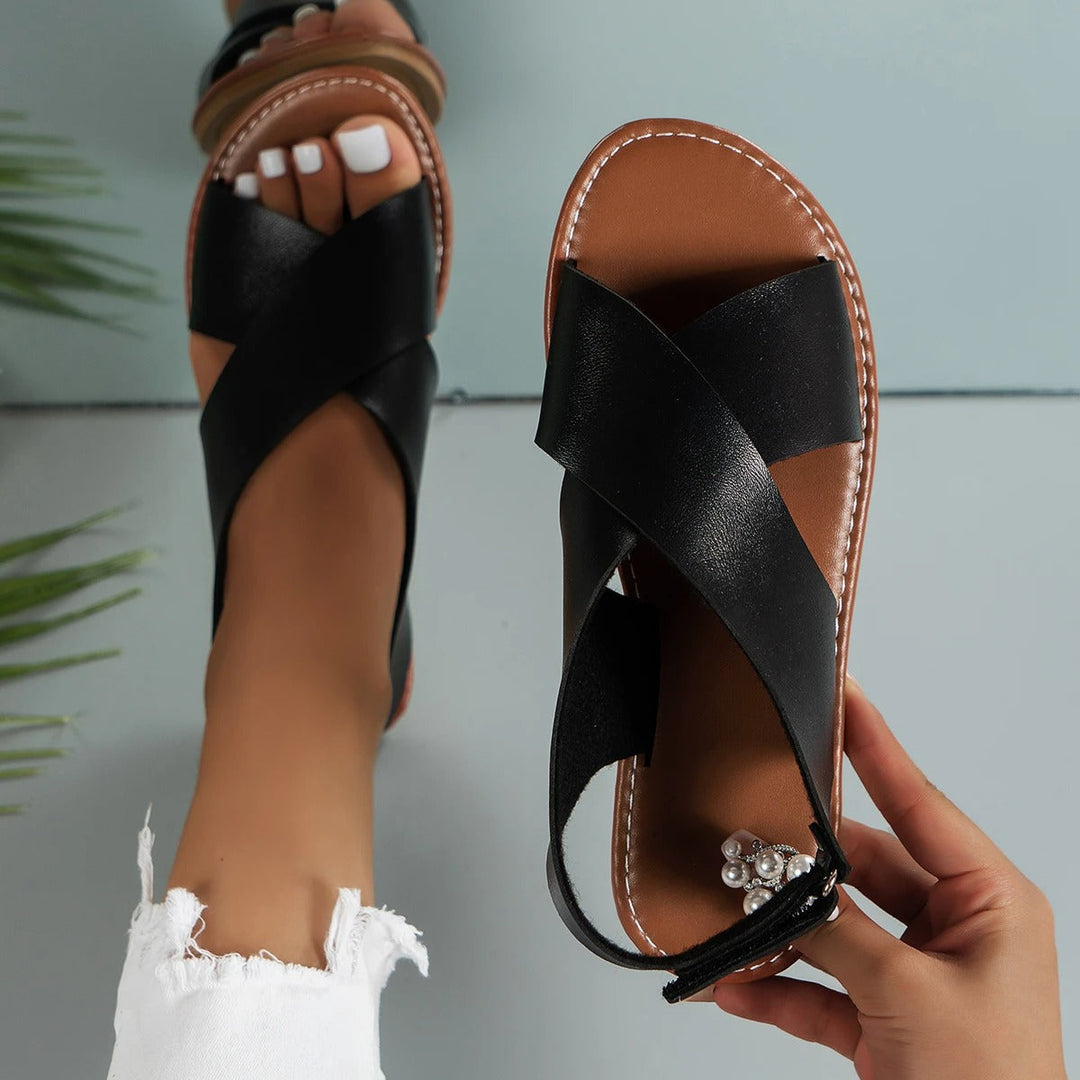 Stylish women's flat sole buckle sandals, offering comfort and support for everyday summer adventures.