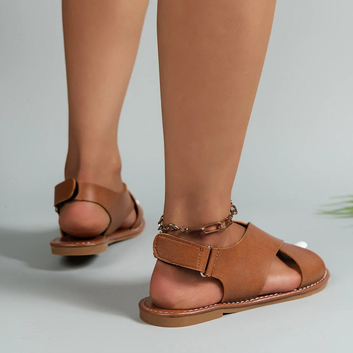 Chic women's summer buckle sandals with a comfortable flat sole and adjustable strap for daily wear.