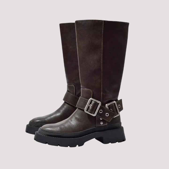 Women's buckle strap knee-high boots in brown, featuring a chunky sole for stylish winter footwear.