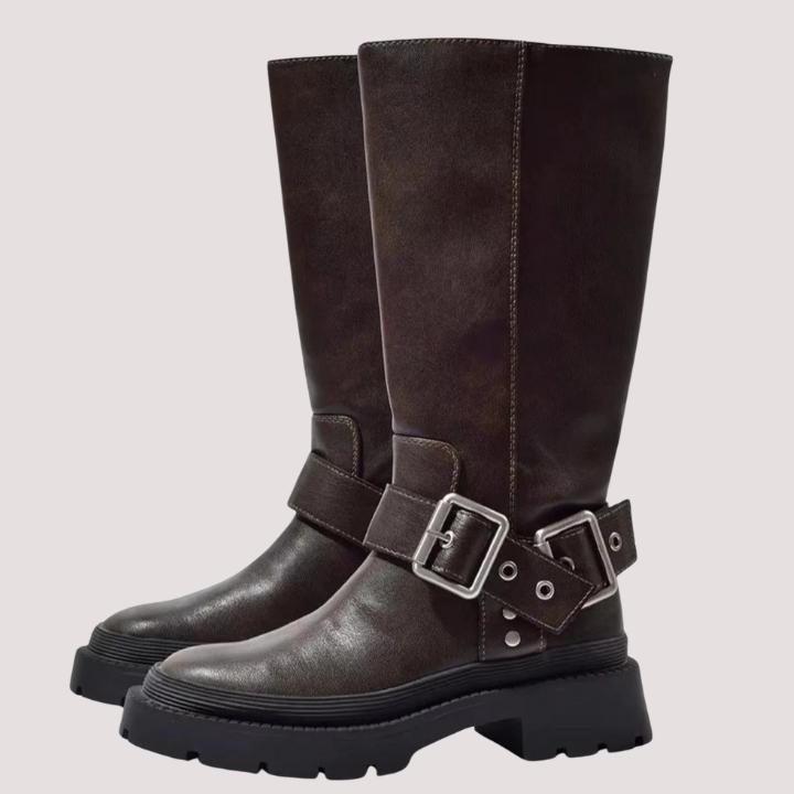 Elegant women's tall brown boots with buckle straps, perfect for elevated fashion and winter outfits.