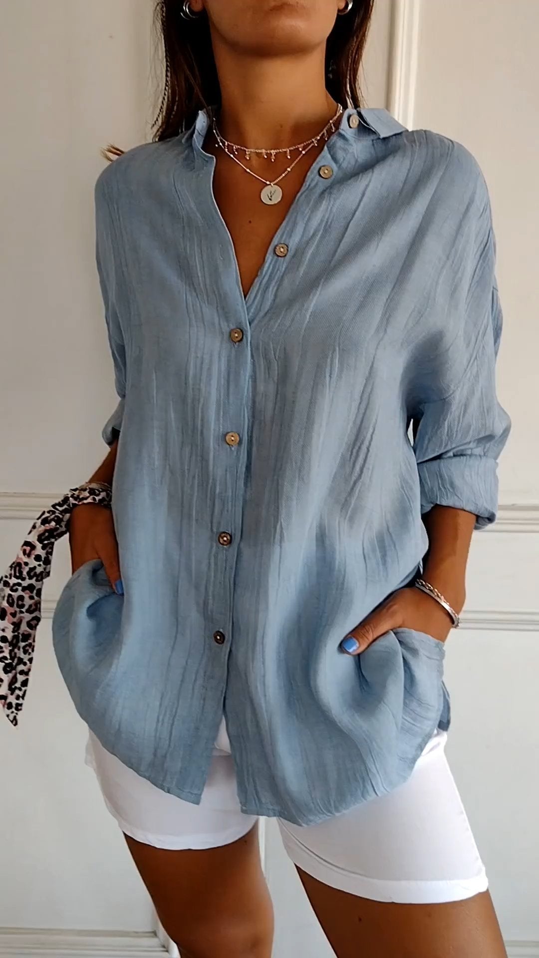 Women's button-down long sleeve blouse, a versatile top for casual or elegant fashion.