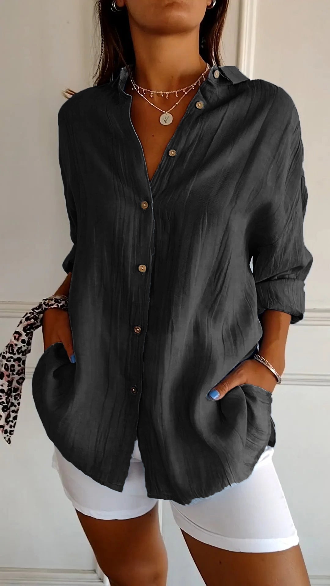 Spring/summer women's long sleeve button-down blouse, a versatile and fashionable top.