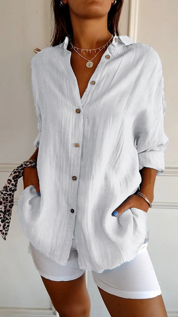 Chic women's long sleeve button-down blouse, essential for versatile fashion and an elegant look.